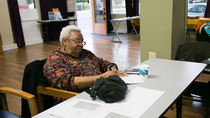 Wilma Alcock seated at a table during a meeting of the Portland Harbor Community Coalition