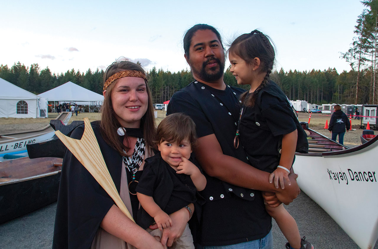 A family portrait taken at a canoe gathering